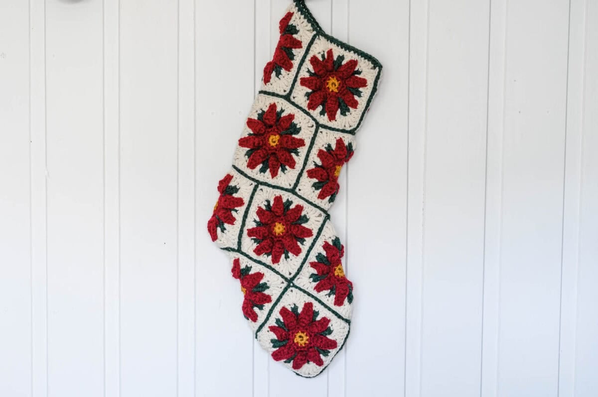 Poinsettia Granny Square Christmas Stocking with a white background