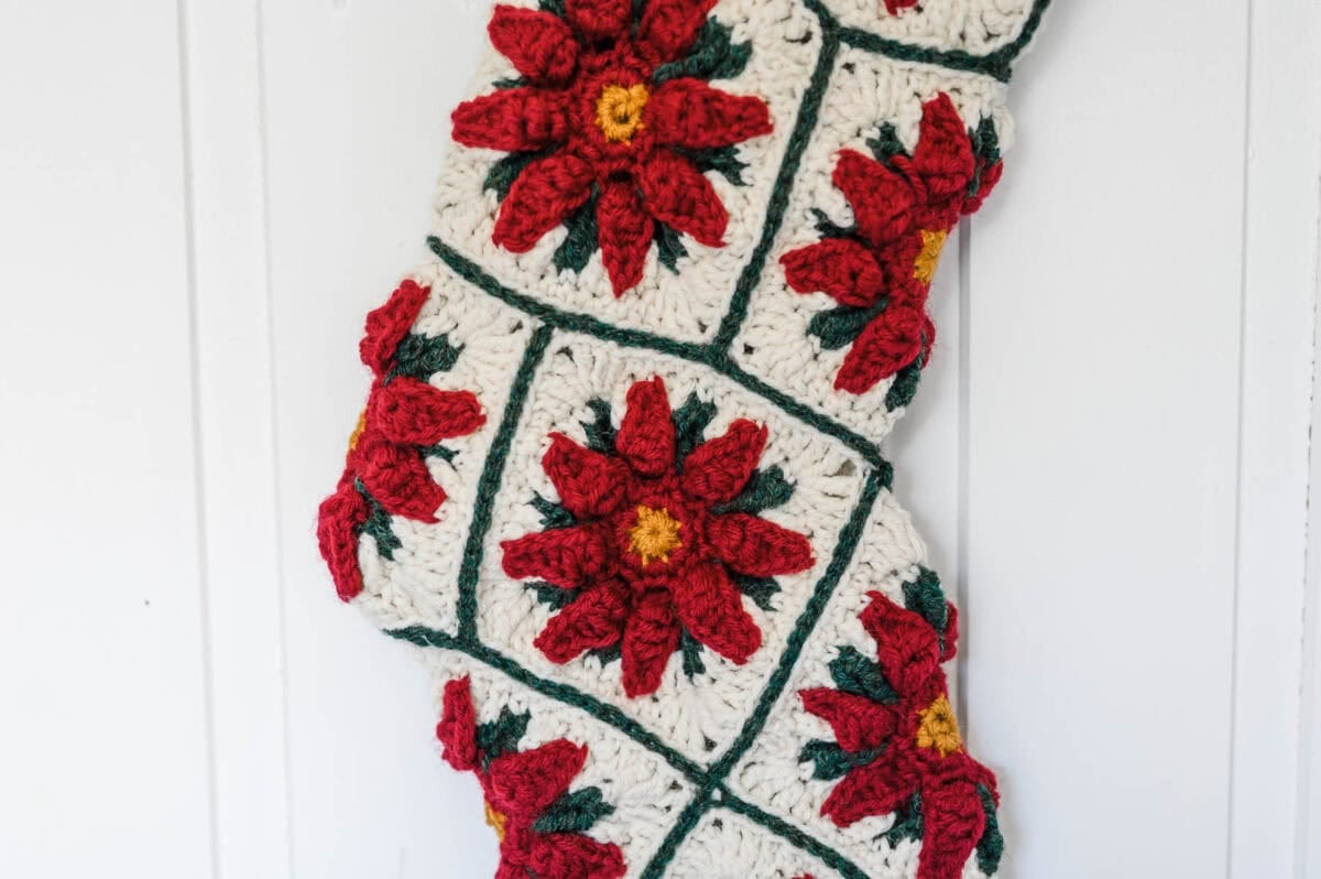 Poinsettia Granny Square Christmas Stocking with a white background