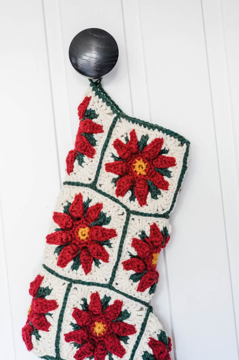 Poinsettia Granny Square Christmas Stocking with a white background