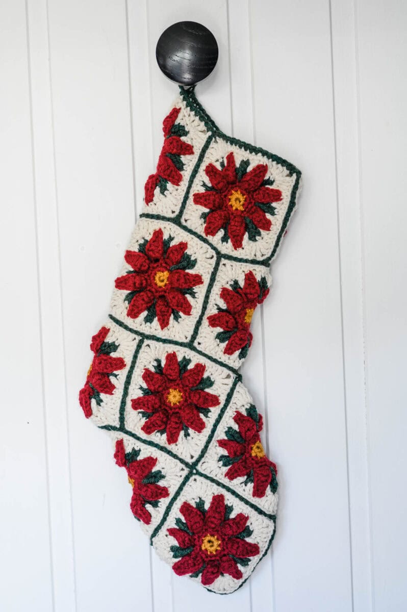 Poinsettia Granny Square Christmas Stocking with a white background