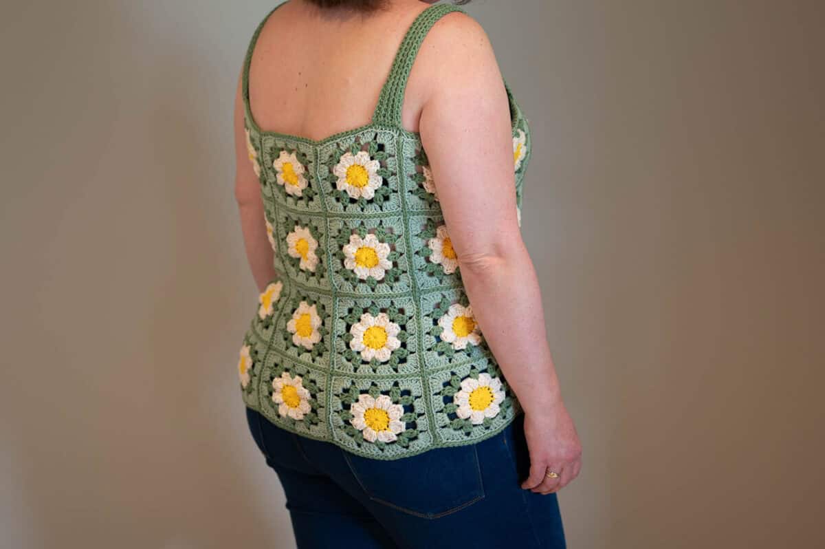 Crochet Granny Square Tank Top with sunflower motifs in sunflower, oatmilk, sage, and misty green colors.