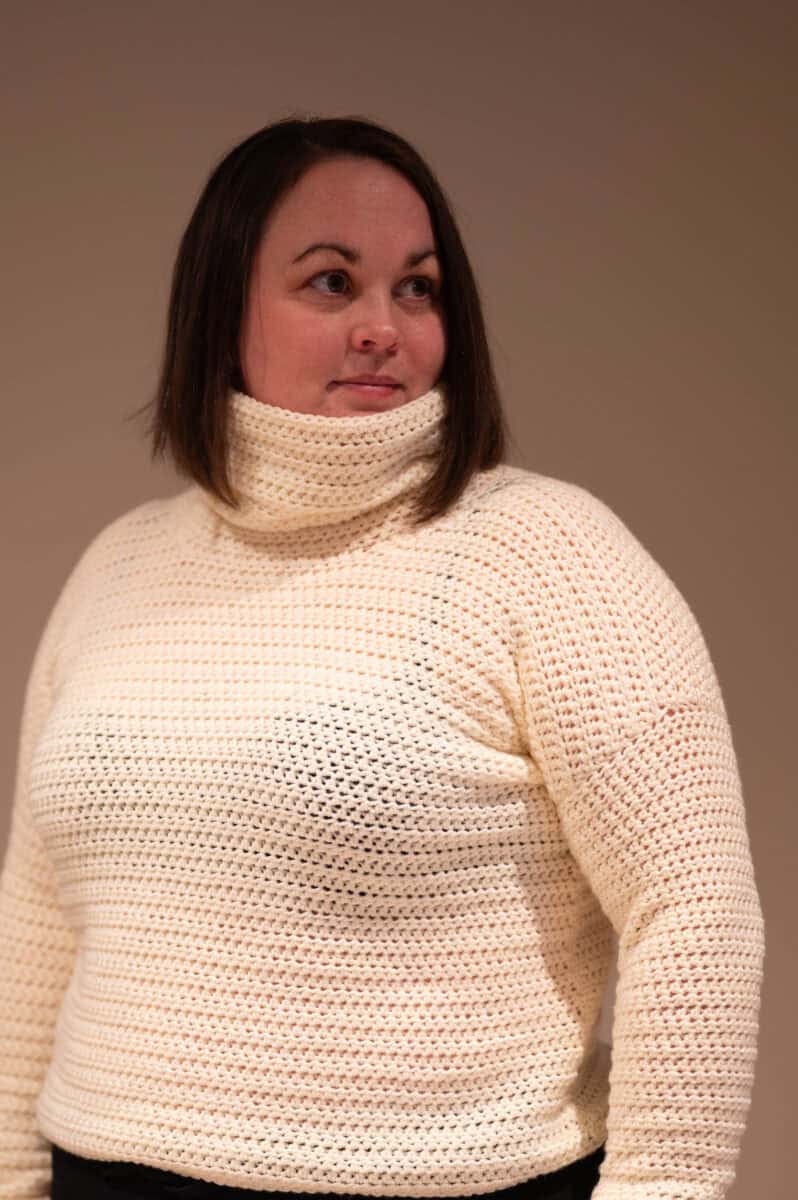 Off-white crochet cowl neck sweater made with Hobbii Kind Feather yarn, showcasing a textured stitch pattern.